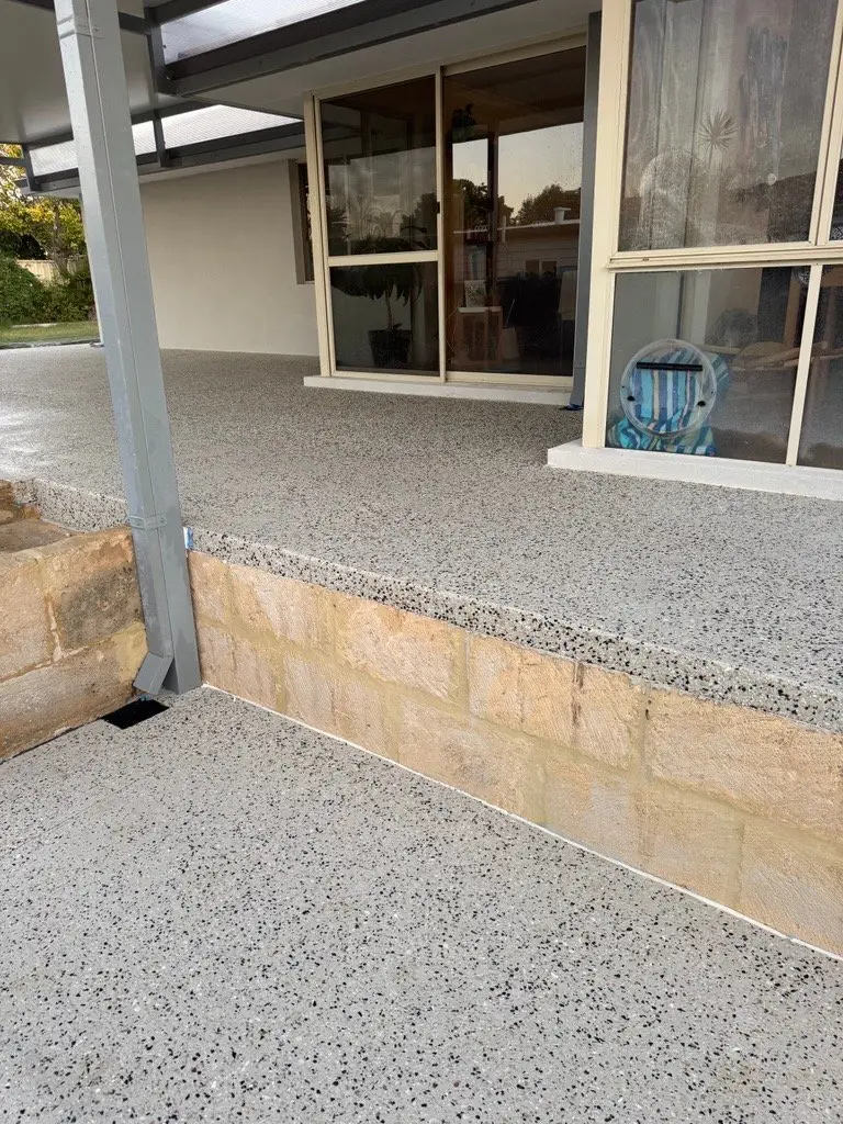Atlantis Beach exposed aggregate alfresco with limestone block steps