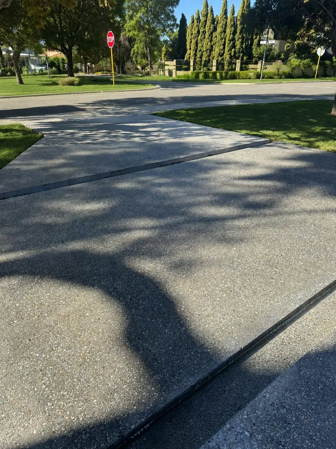 Amber Grey exposed aggregate driveway and crossover to the street
