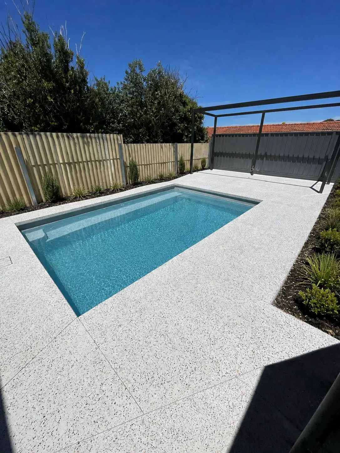 Kaajani White exposed aggregate pool surround