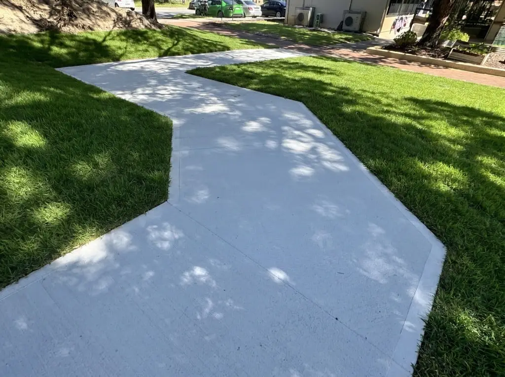 Brush finish grey concrete footpath through the grounds at Dianella Primary School